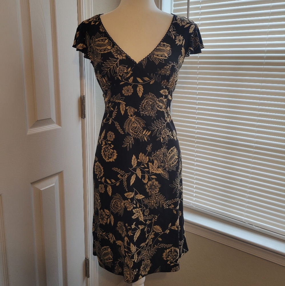 Dress, retro-ish tan print on black.